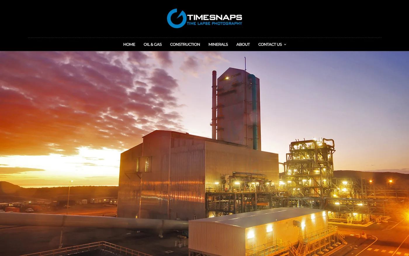 The Time Snaps website showing an industrial site at sunset